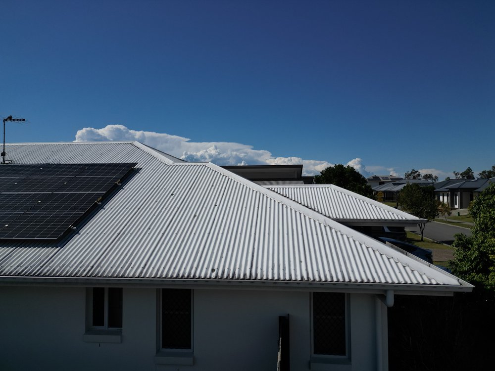 Correct, hip flashing flush with the roof sheeting behind
