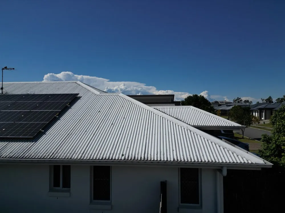 Correct, hip flashing flush with the roof sheeting behind