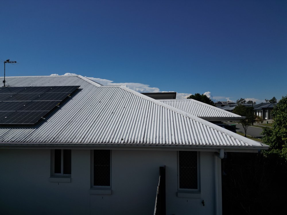 Too low, drone angled up, hip appears higher than the sheeting